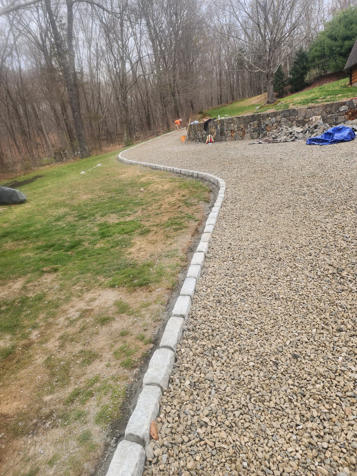 Belgian block border framing a curved driveway in Connecticut