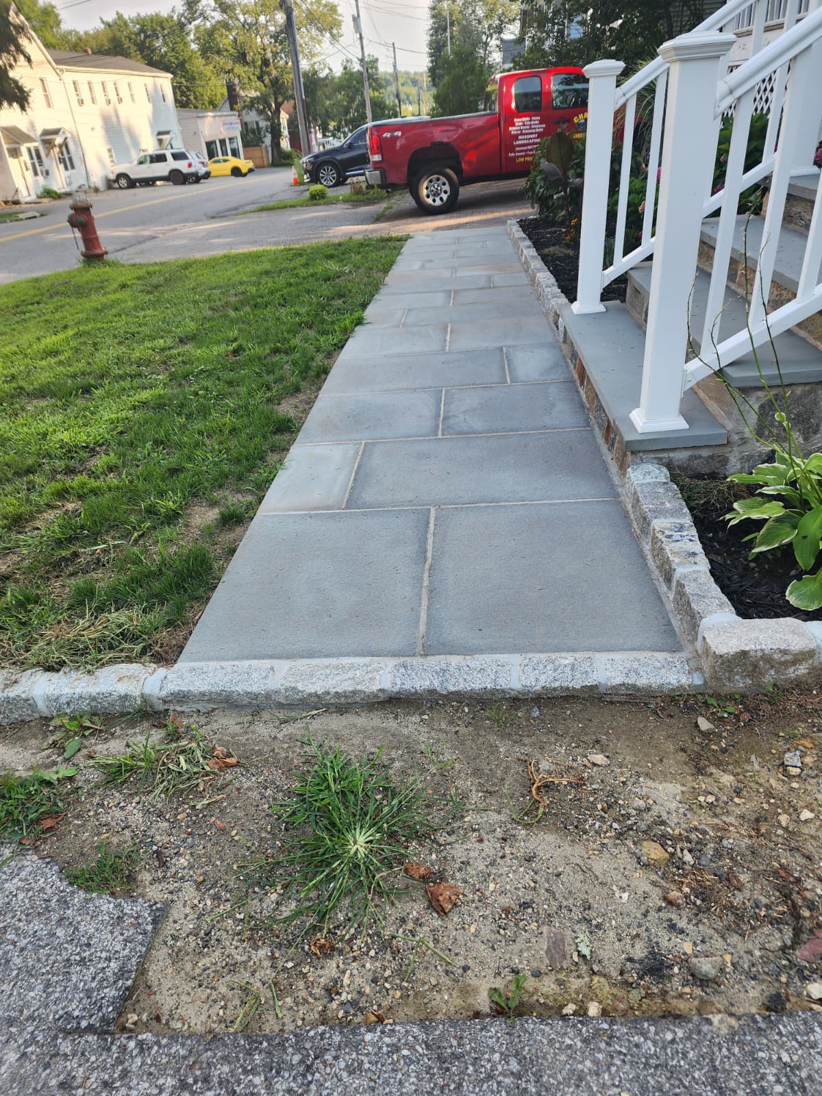 Bluestone sidewalk with Belgian block edge — Connecticut Bluestone sidewalk with Belgian block edging along a residential street