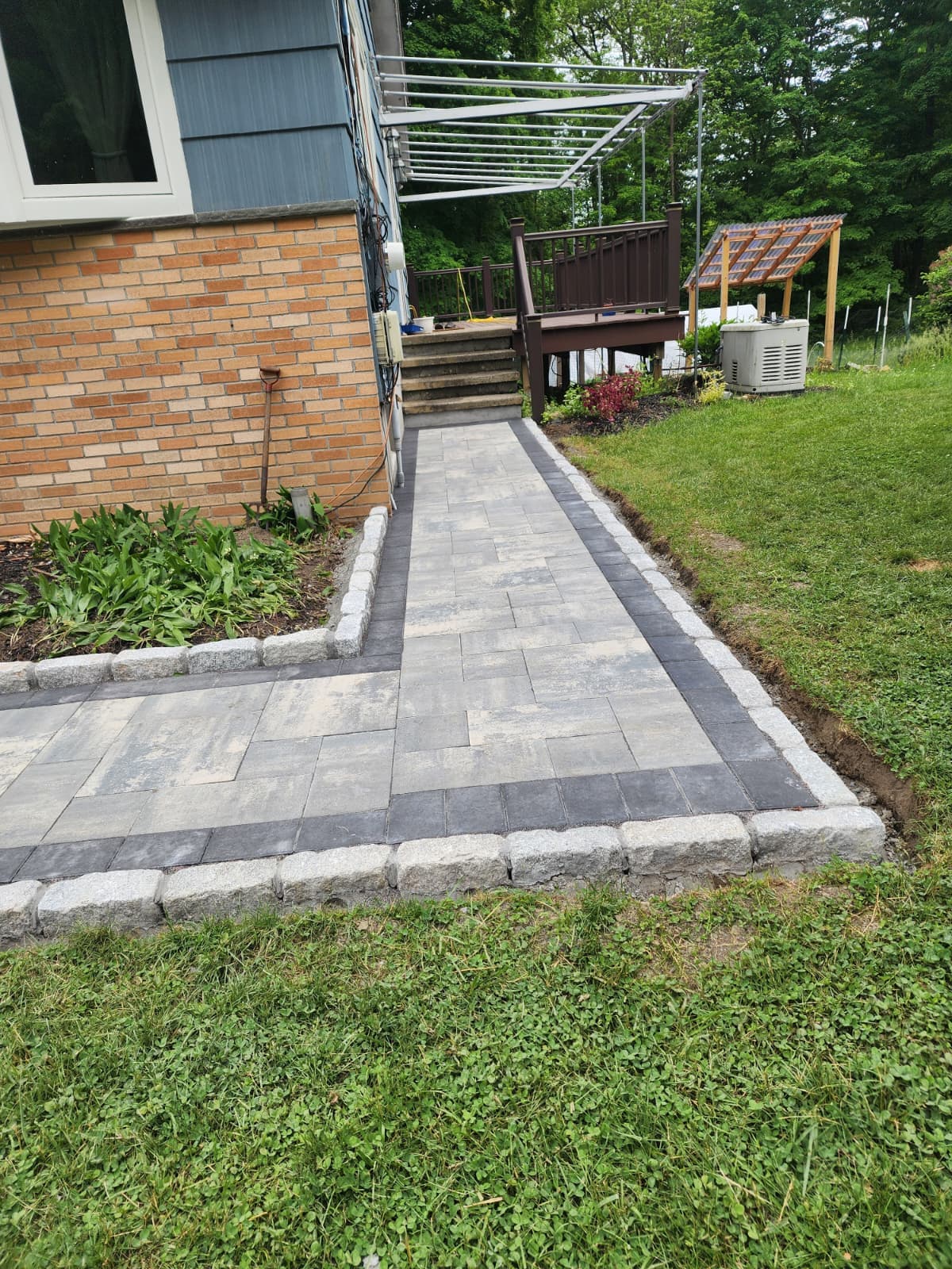 Premium paver walkway with Belgian block edging built by Chabla's Construction LLC in Connecticut