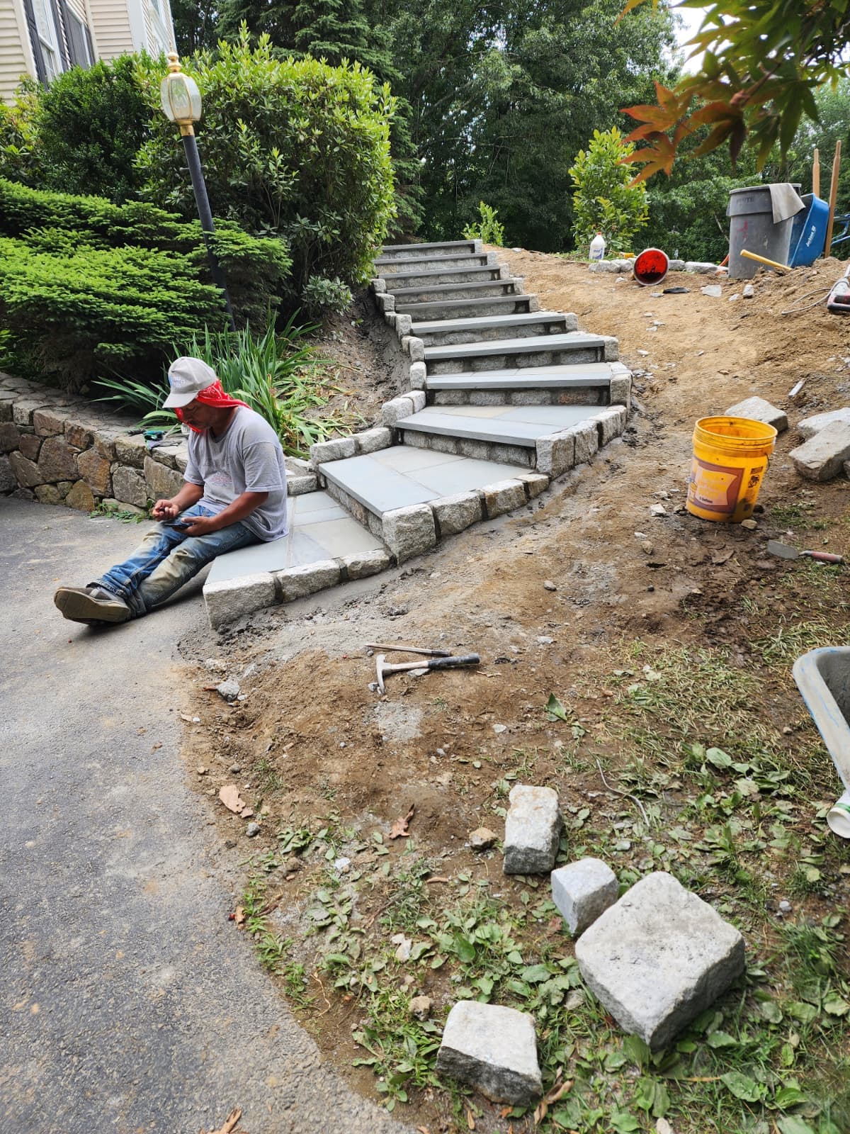 Stone steps under construction — Connecticut Stone steps under construction on a sloped property by Chabla's Construction